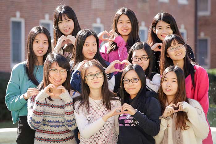 Guangzhou students Guangzhou students make heart signs with their hands to represent Golden Heart Class