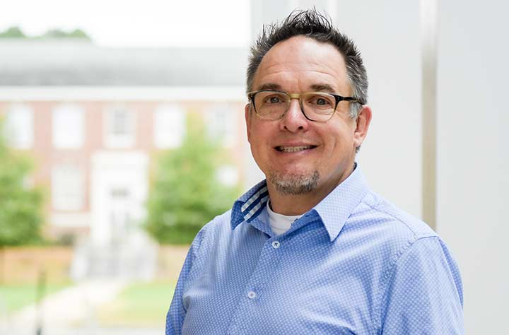 Professor Andrew Wheeler smiles for the camera.