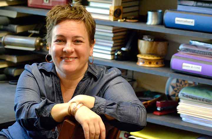 Professor Deidra Donmoyer sits in her office.