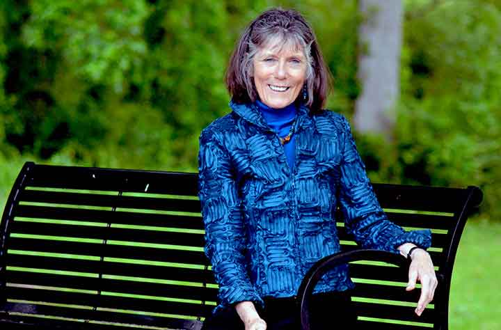 Frazer Lively sits on bench outside porter