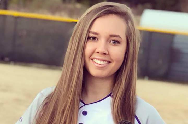 Hannah Allen '21 outside in souftball uniform.