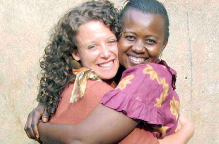 Missy Ward Angalla hugs woman she works with at the shelter.