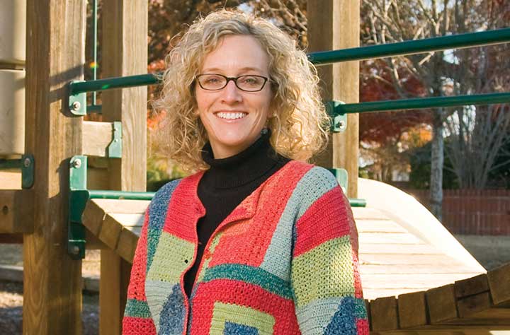 Sandra Gardner standing outside on Methodist Home playground.