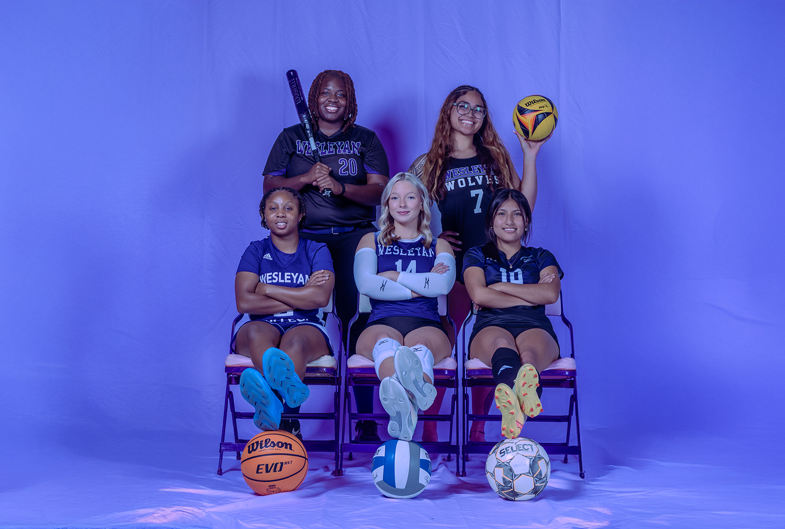 Photo of 5 student athletes, one from each of the major sports the college offers.