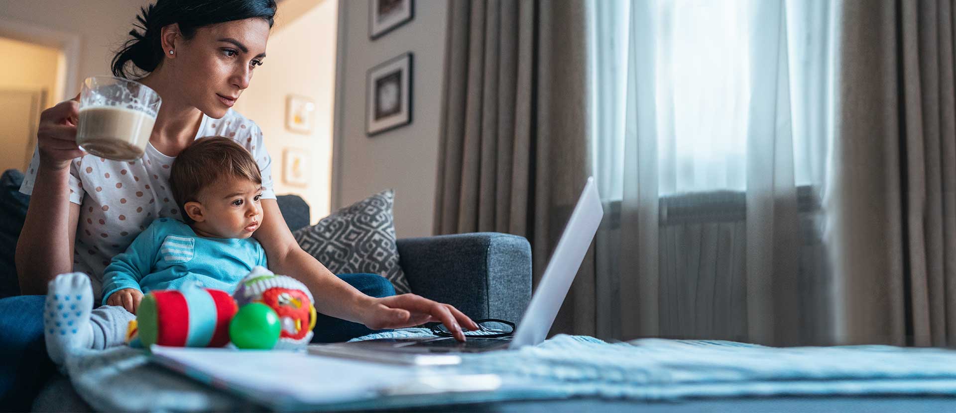 Woman with daughter on laptop