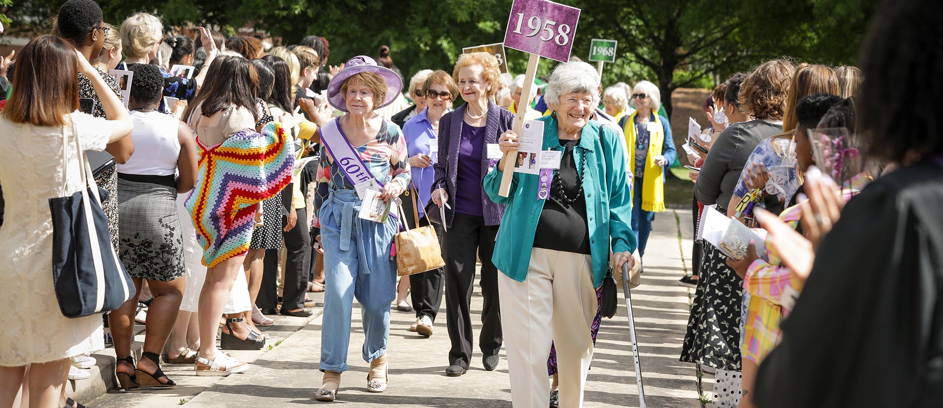 Alumnae cheer and walk with classmates