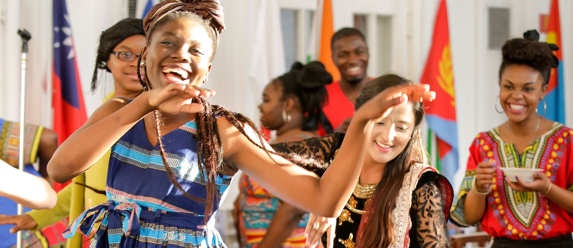 International students dress in their traditional clothing and dance