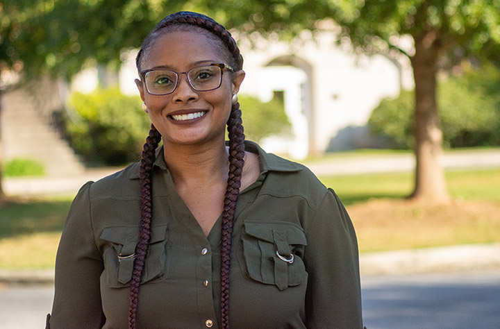 Staff member Alexis Hall smiles for the camera.