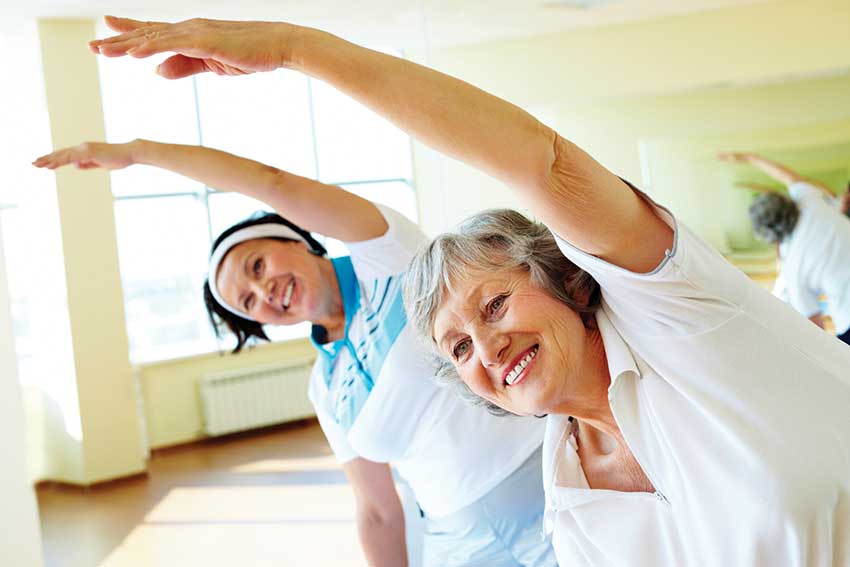 Ladies stretch during yoga class