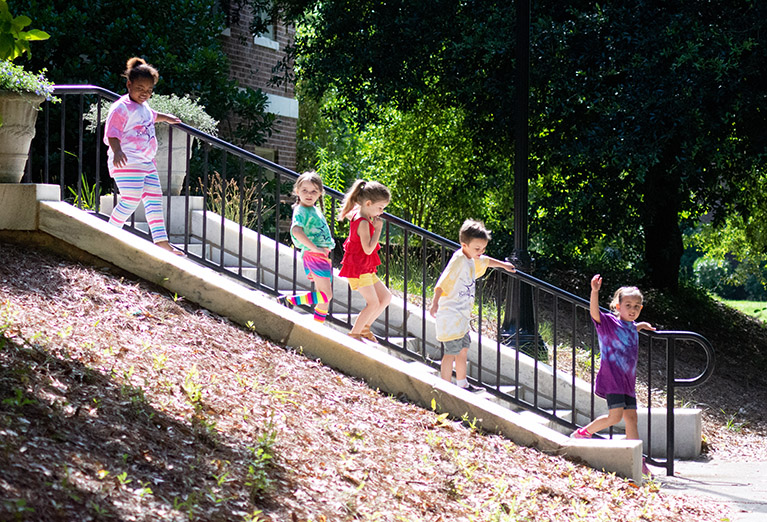 Campers march down the stairs outside of Taylor Hall.