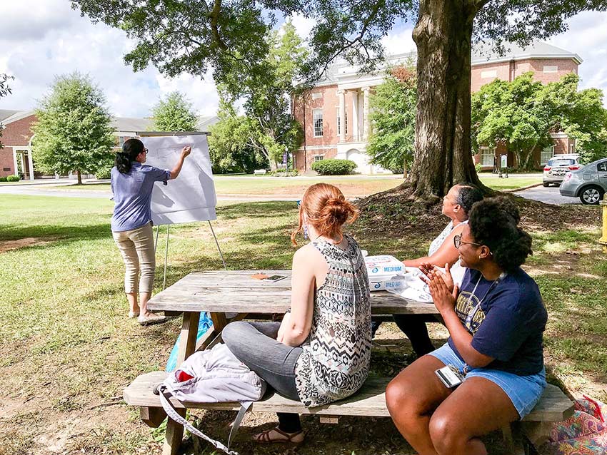 Students study in the Quad outside.