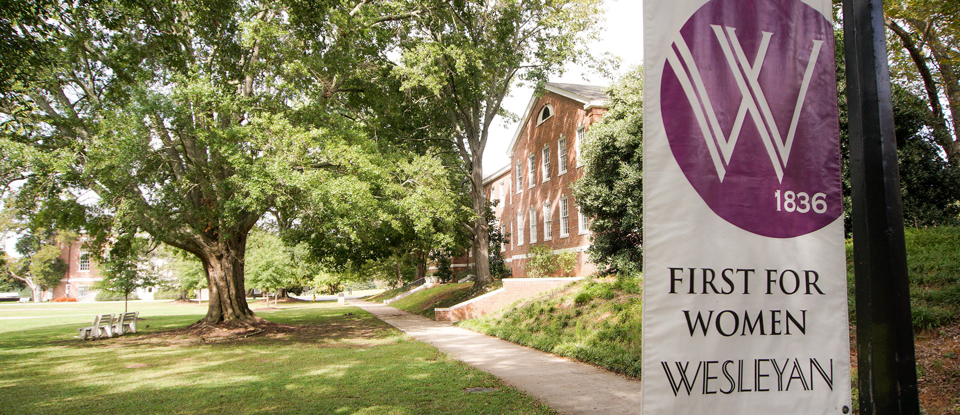 First For Women Sign On Light Post In The Quad Of Wesleyan College